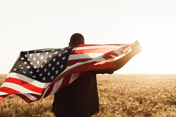 man holding American flag
